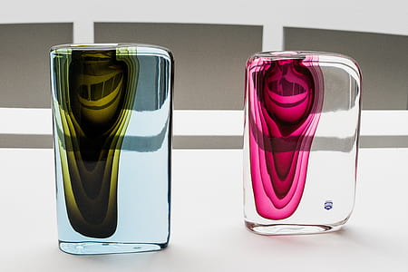 two clear glass paper weights on table thumbnail