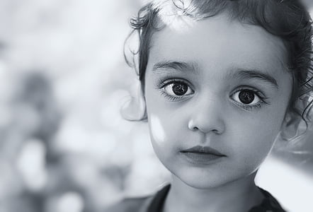 toddler wearing crew-neck top grayscale photography thumbnail