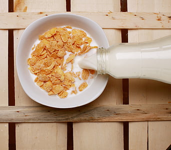 white ceramic bowl with cereals and milk thumbnail