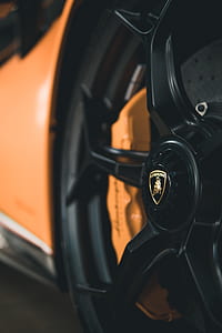 close-up photo of black and orange car thumbnail