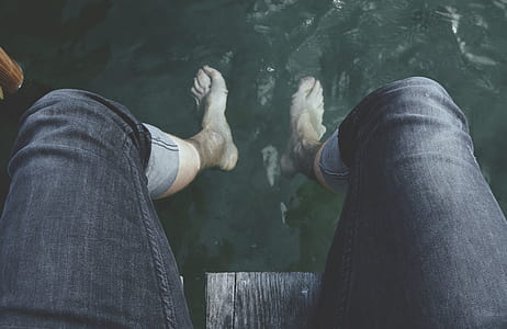 person soaking his feet on water thumbnail