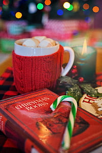 white and green candy can on the top of book thumbnail