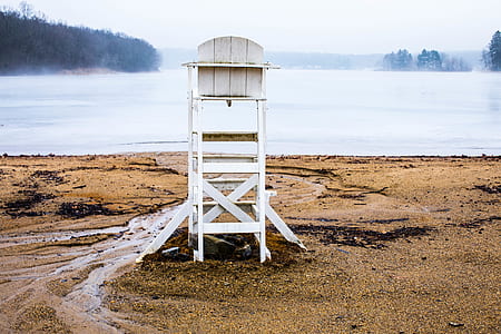 lifeguard highchair in front of body of water thumbnail
