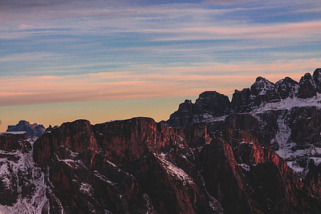 photo of brown and white snowing mountains thumbnail