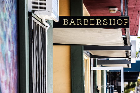 Barbershop signage beside awning thumbnail