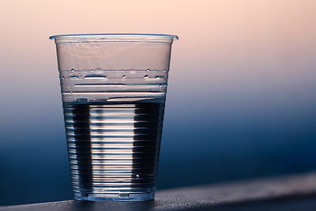 Clear Plastic Cup on Gray Surface thumbnail