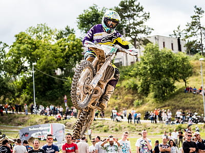man ramping motocross sport during daytime thumbnail