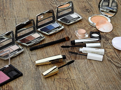 assorted cosmetics on brown wooden board thumbnail