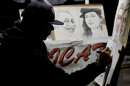 man holding pen painting thumbnail