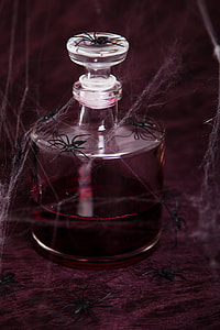 close photo of clear glass container with red liquid inside thumbnail