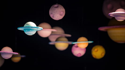 focus photo of blue Saturn planet thumbnail