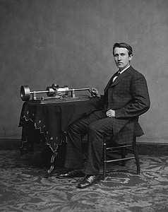 man sitting on chair beside gray metal tool placed on table thumbnail