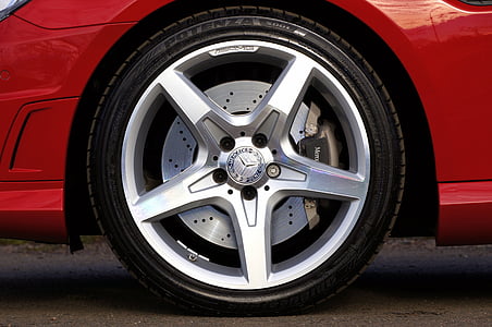 closeup photograhy of chrome-colored Mercedes-Benz 5-spoke vehcle wheel and Bridgestone Potenza tire thumbnail
