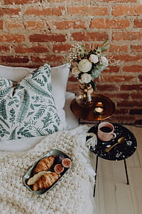 A lovely woman's bedroom with a beautiful bouquet of flowers thumbnail