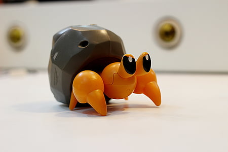 black and orange plastic sea creature toy thumbnail