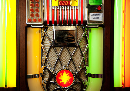brown, green, and yellow jukebox machine thumbnail
