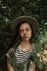girl standing near tree thumbnail