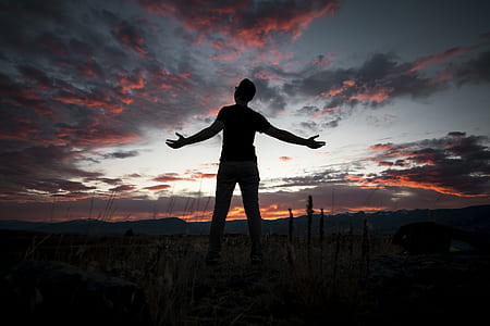 person in black shirt under cloudy sky thumbnail