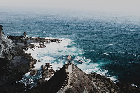 aerial photography of body of water near island thumbnail