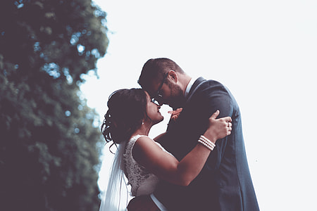 groom and bride under tree thumbnail
