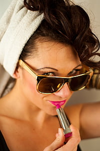woman holding pink lipstick thumbnail