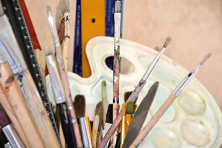assorted paint brushes in shallow focus photography thumbnail