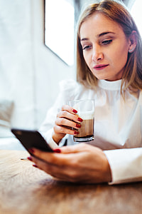 Pretty blonde woman sitting in the cafe thumbnail