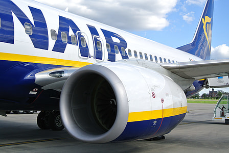white and blue plane under clear sky thumbnail