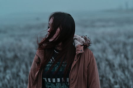 woman standing facing at side waty thumbnail