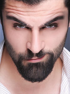 man wearing white collared top thumbnail