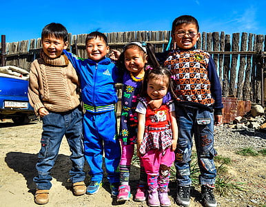children standing near brown wooden fence thumbnail