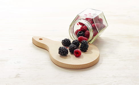 Clear Glass Bottle With Raspberries Inside thumbnail