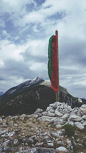 landscape photography of mountains under blue sky thumbnail