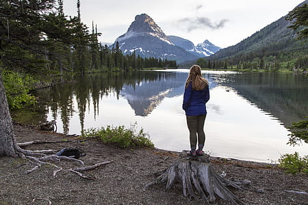 woman standing in front of lake thumbnail