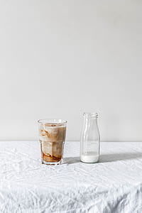 two glasses filled with beverages thumbnail