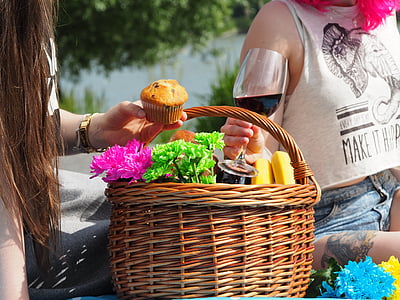 two people beside brown wicker basket thumbnail