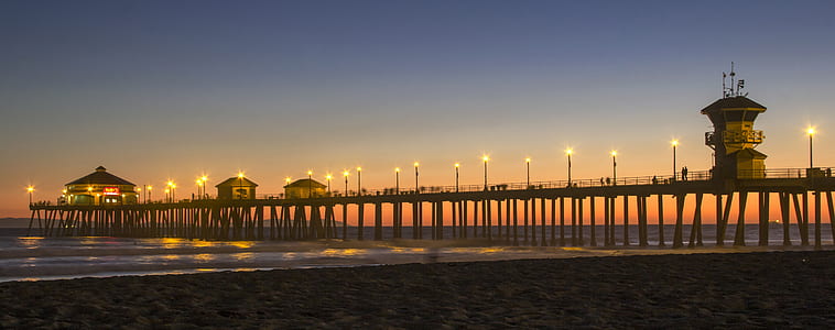 brown wooden dock with lights during golden hourse thumbnail