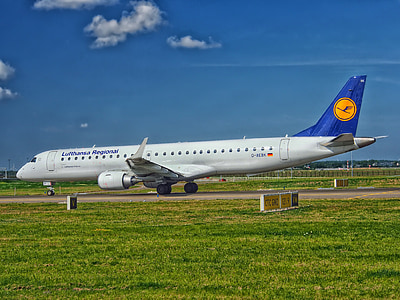 white and blue airliner during daytime thumbnail