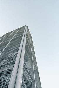low angle photography of building under blue sky thumbnail