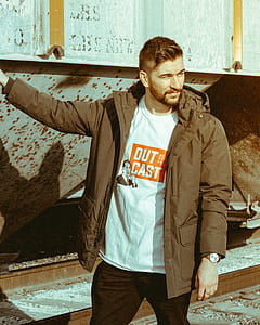 man wearing brown jacket thumbnail