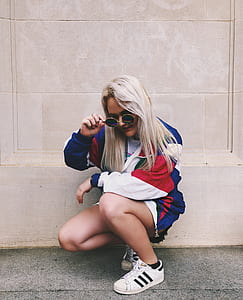 woman docking while holding her sunglasses thumbnail