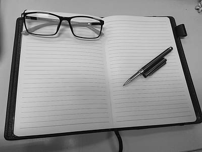 eyeglasses on notebook thumbnail