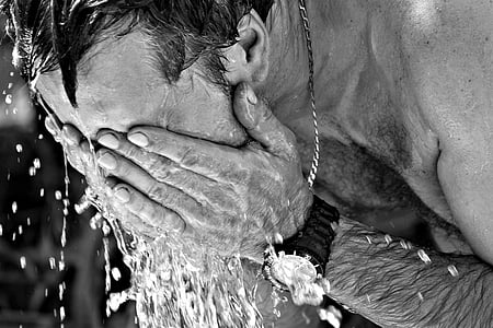 grayscale photography of man washing face thumbnail