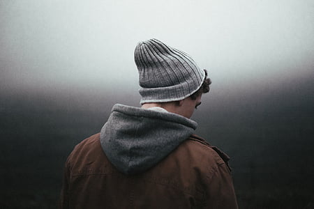 man facing back in gray room thumbnail