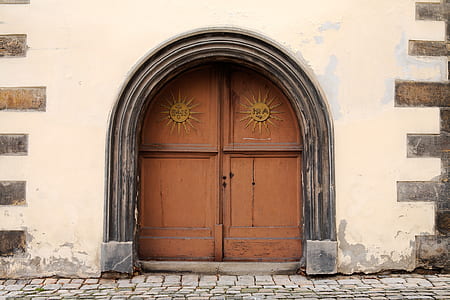 closed brown wooden doors thumbnail