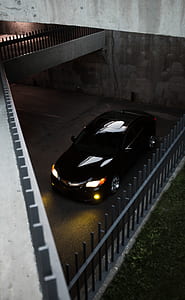 black Acura parked inside the building thumbnail