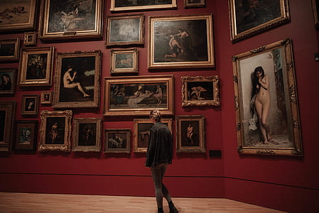 person looking at paintings thumbnail