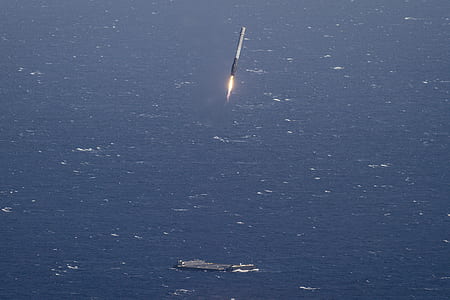 gray and black rocket above the sky thumbnail