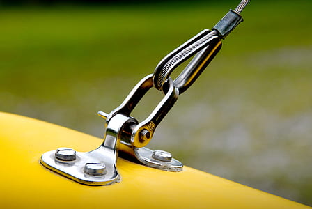 gray stainless steel on yellow surface at daytime thumbnail