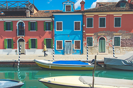 several boats on body of water beside of walkway thumbnail